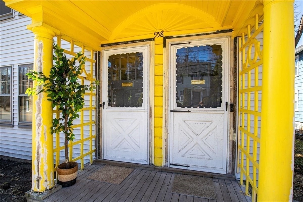 558 Lagrange Street, Unit 1 Boston, MA 02132 - Photo 37 of 40 a view of front door of house with a glass door
