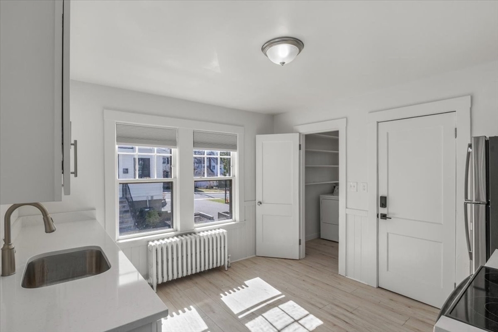 558 Lagrange Street, Unit 1 Boston, MA 02132 - Photo 10 of 40 a bedroom with windows