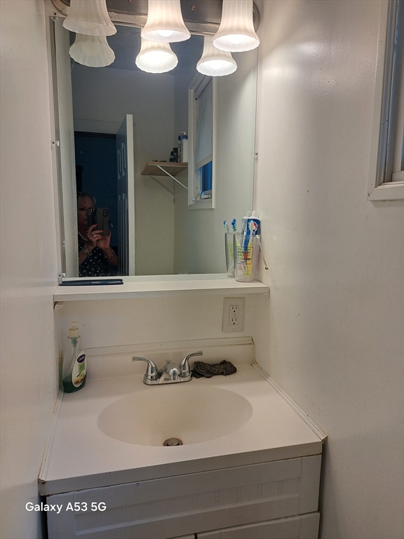 360 Hamilton Street Worcester, MA 01604 - Photo 28 of 35 a bathroom with a sink and a mirror