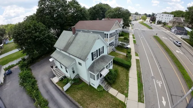 a aerial view of a house with a yard