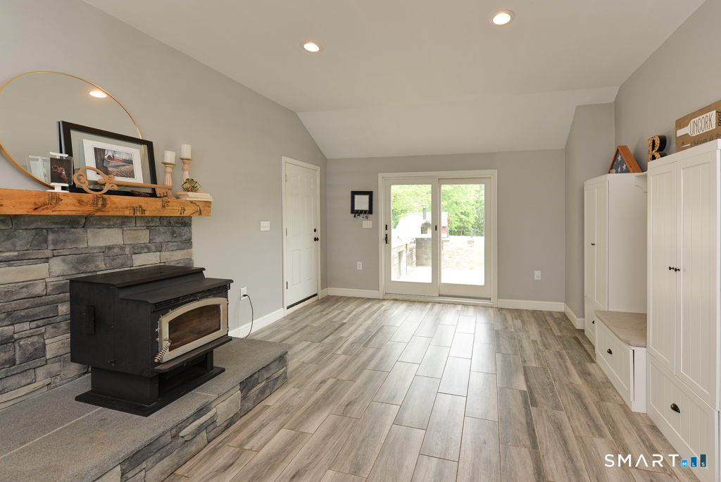 109 Harrison Lane Bethlehem, CT 06751 - Photo 11 of 28 a view of an empty room with wooden floor and a window