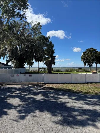 a view of a swimming pool with a bench