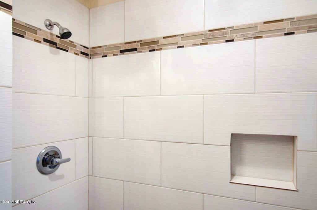 1944 Constant Drive Jacksonville, FL 32210 - Photo 11 of 21 a bathroom with a shower and a shower in a window