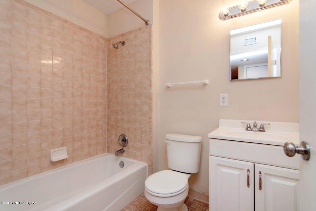 1944 Constant Drive Jacksonville, FL 32210 - Photo 12 of 21 a bathroom with a sink a toilet and shower