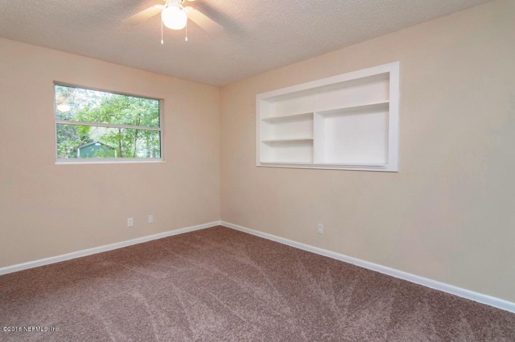 1944 Constant Drive Jacksonville, FL 32210 - Photo 16 of 21 an empty room with a window