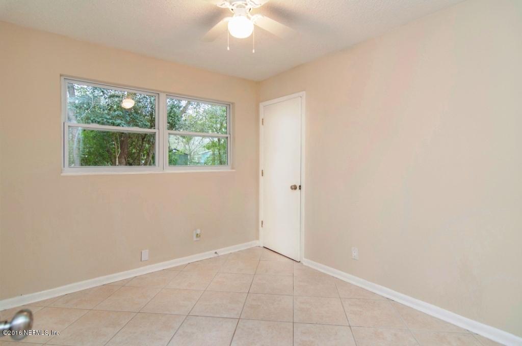 1944 Constant Drive Jacksonville, FL 32210 - Photo 18 of 21 an empty room with a window