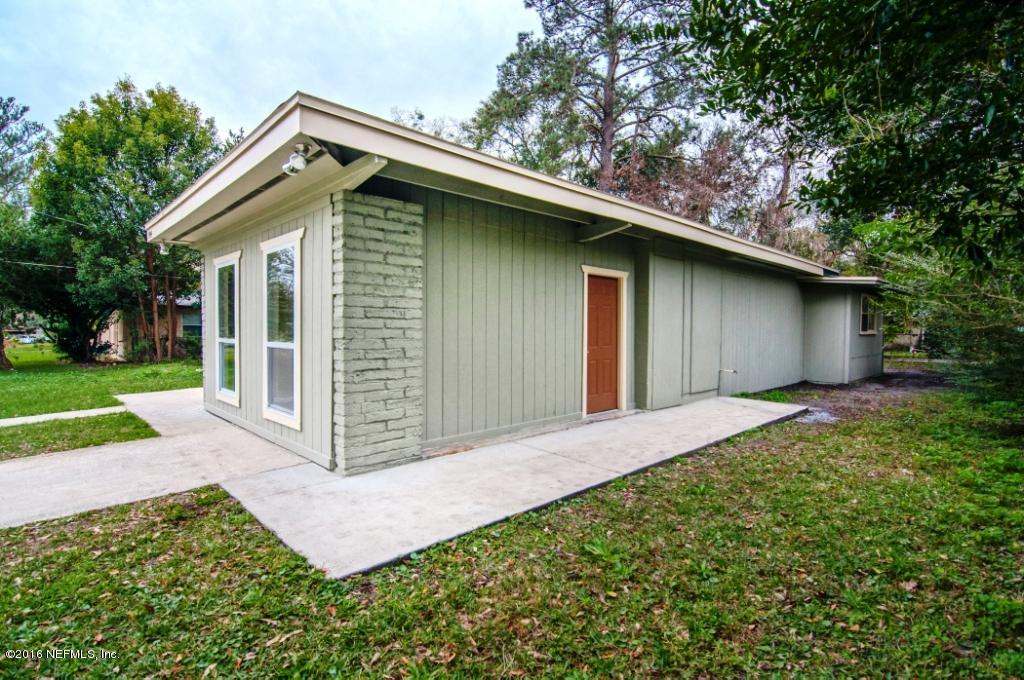 1944 Constant Drive Jacksonville, FL 32210 - Photo 2 of 21 a front view of house with yard and green space