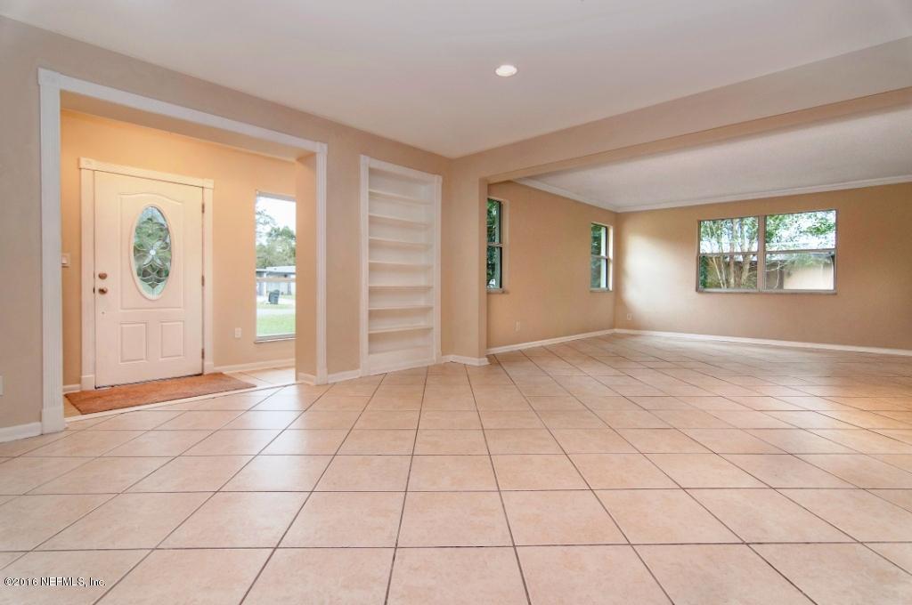1944 Constant Drive Jacksonville, FL 32210 - Photo 3 of 21 an empty room with windows and closet