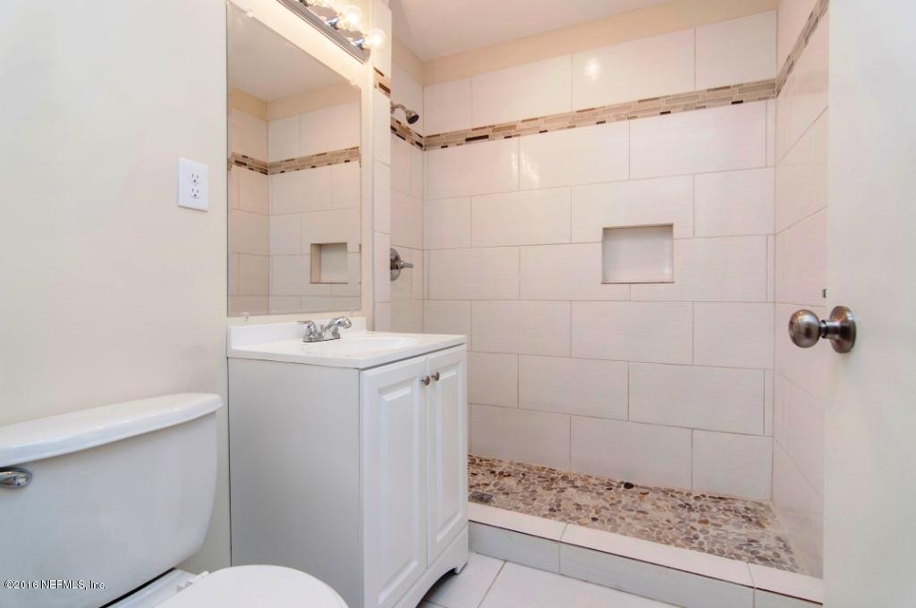 1944 Constant Drive Jacksonville, FL 32210 - Photo 10 of 21 a bathroom with a sink a toilet and shower