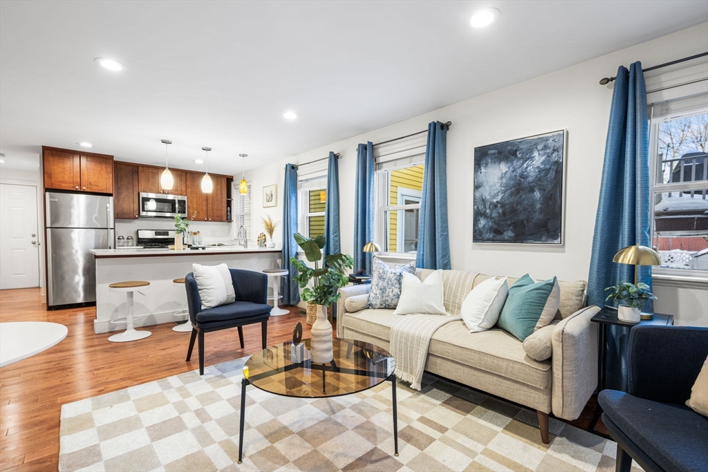 50 Spring Street Cambridge, MA 02141 - Photo 11 of 36 a living room with furniture and kitchen view