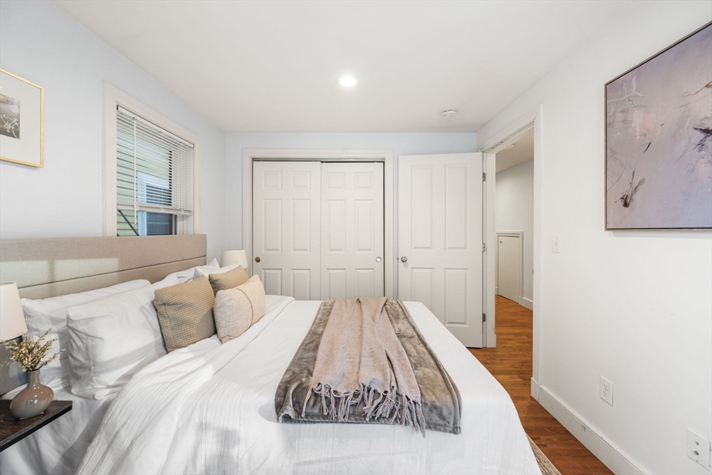 50 Spring Street Cambridge, MA 02141 - Photo 17 of 36 a bed sitting in a bedroom next to a window