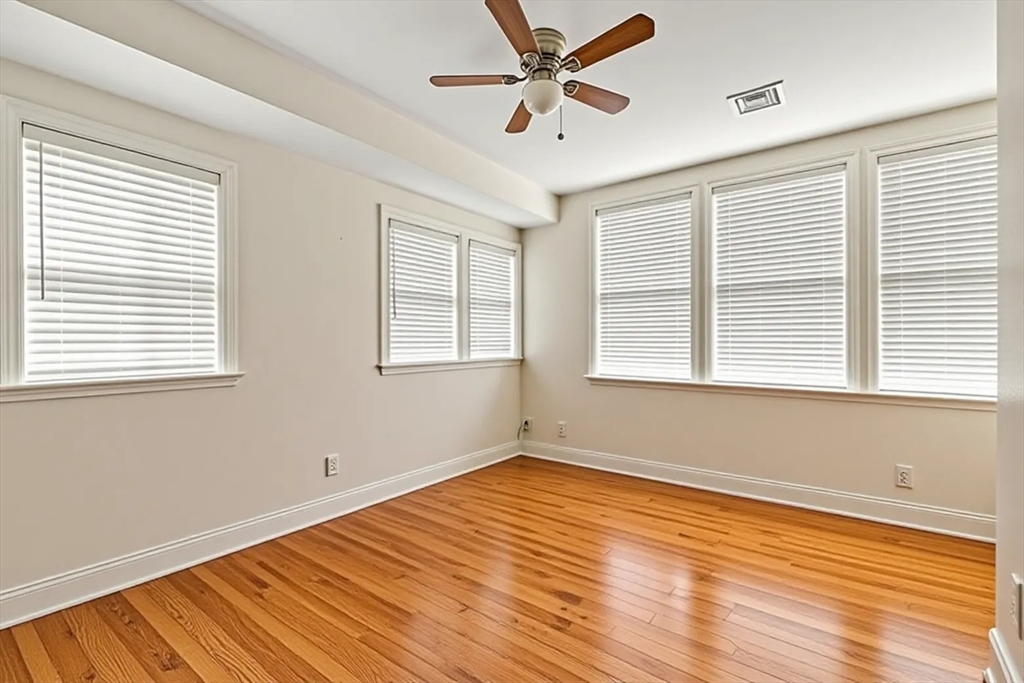 50 Spring Street Cambridge, MA 02141 - Photo 23 of 36 a view of empty room with wooden floor and fan