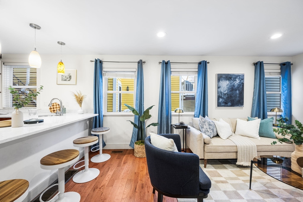 50 Spring Street Cambridge, MA 02141 - Photo 3 of 36 a living room with furniture and a large window