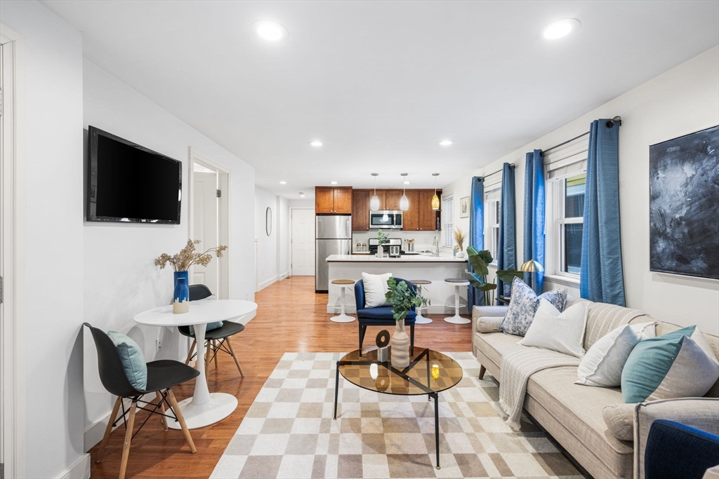 50 Spring Street Cambridge, MA 02141 - Photo 4 of 36 a living room with furniture and a flat screen tv
