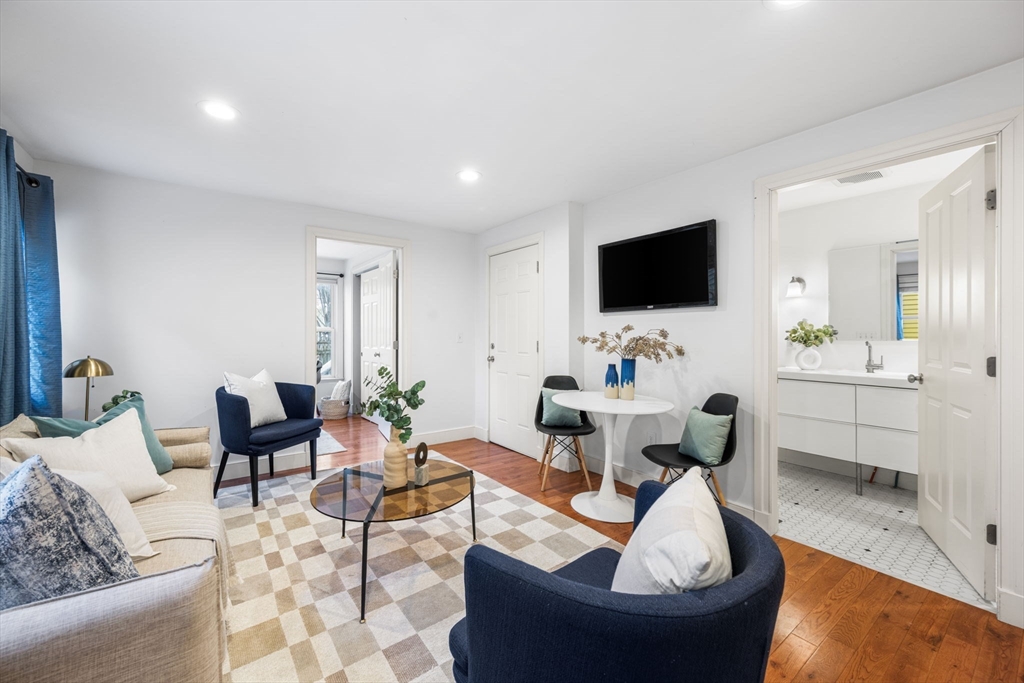 50 Spring Street Cambridge, MA 02141 - Photo 10 of 36 a living room with furniture and a flat screen tv