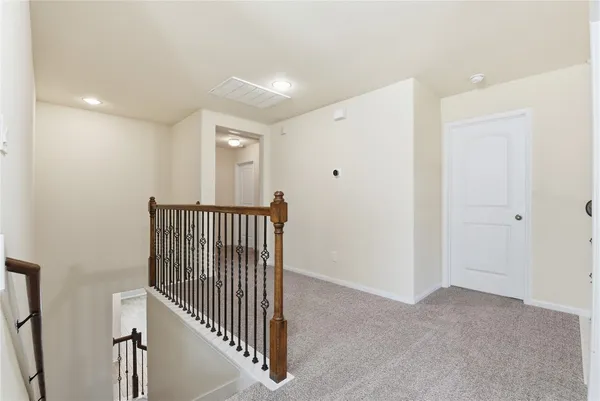a view of a hallway with entryway door