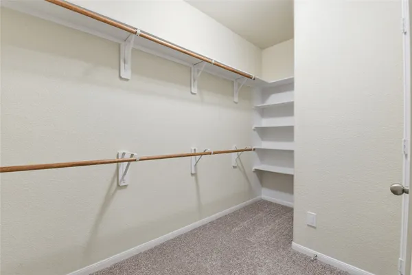 a view of an empty walk in closet