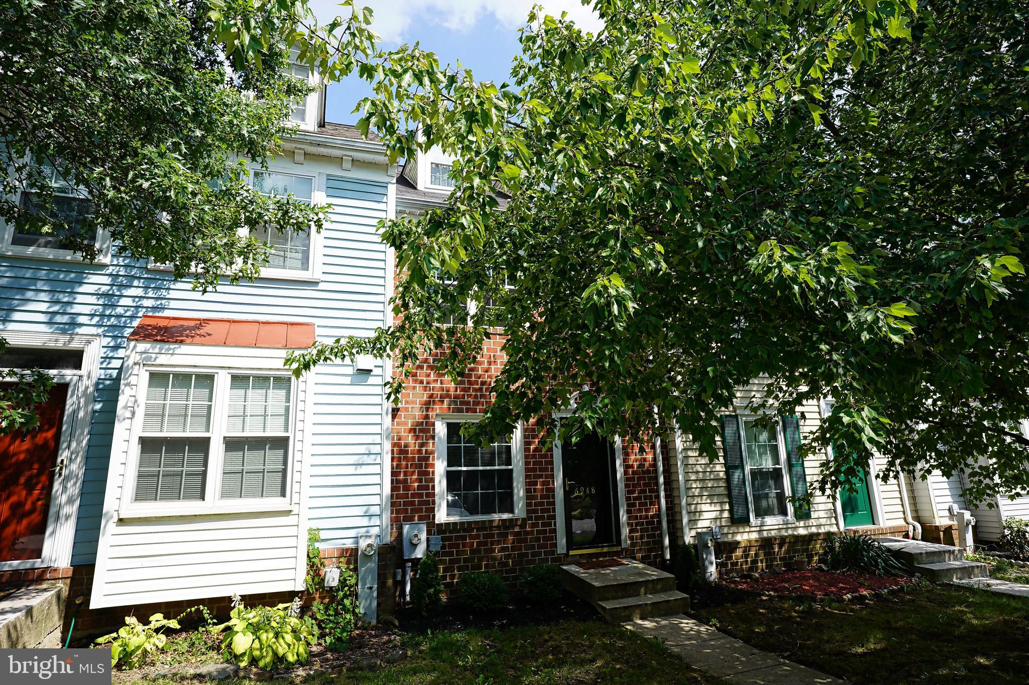 6948 Rockfield Road Baltimore, MD 21244 - Photo 2 of 47 a front view of a house with a garden