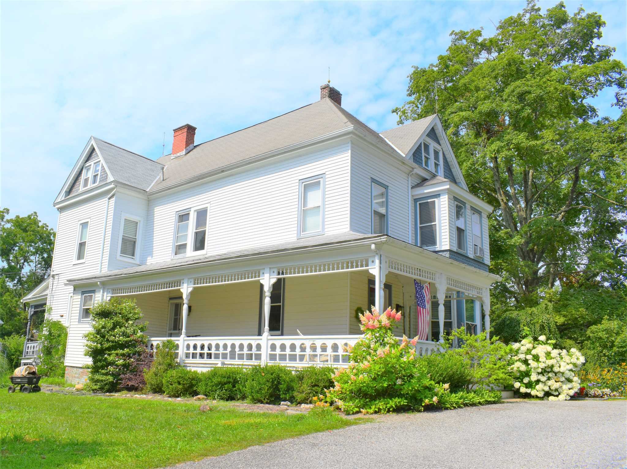 18 Overlook Road Poughkeepsie, NY 12603 - Photo 2 of 30 a front view of a house with a yard and potted plants