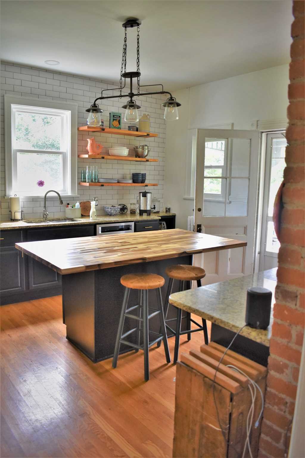 18 Overlook Road Poughkeepsie, NY 12603 - Photo 14 of 30 a kitchen with a dining table chairs sink and granite counter tops