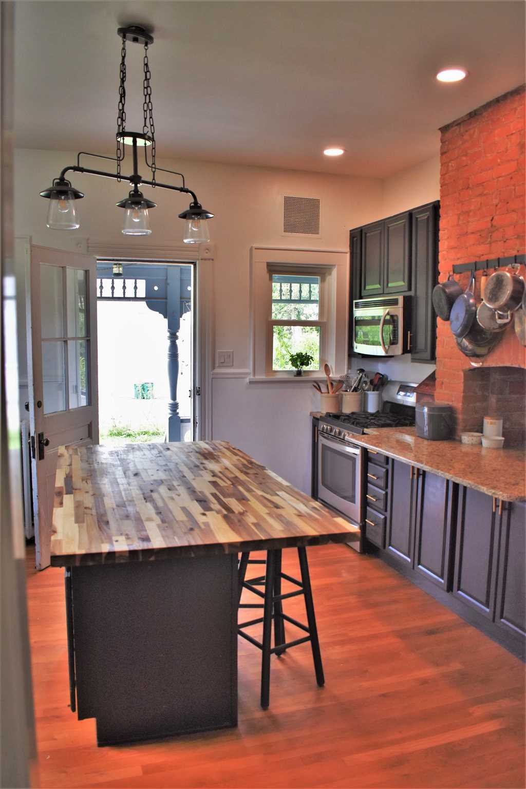 18 Overlook Road Poughkeepsie, NY 12603 - Photo 16 of 30 a kitchen with a table chairs and wooden floor
