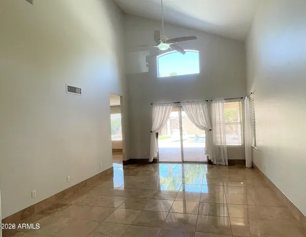 a view of empty room with a fireplace