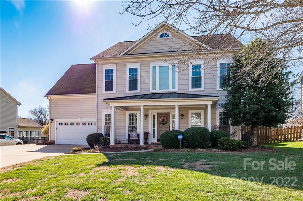 615 Circle Trace Road Monroe, NC 28110 - Photo 1 of 35 a view of a white house with a yard and plants