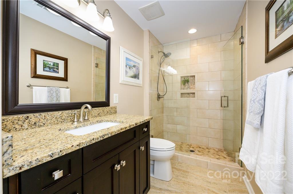 615 Circle Trace Road Monroe, NC 28110 - Photo 23 of 35 a bathroom with a granite countertop sink toilet and shower