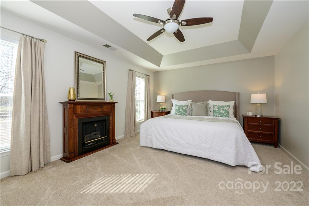 615 Circle Trace Road Monroe, NC 28110 - Photo 24 of 35 a bedroom with a bed and a fireplace