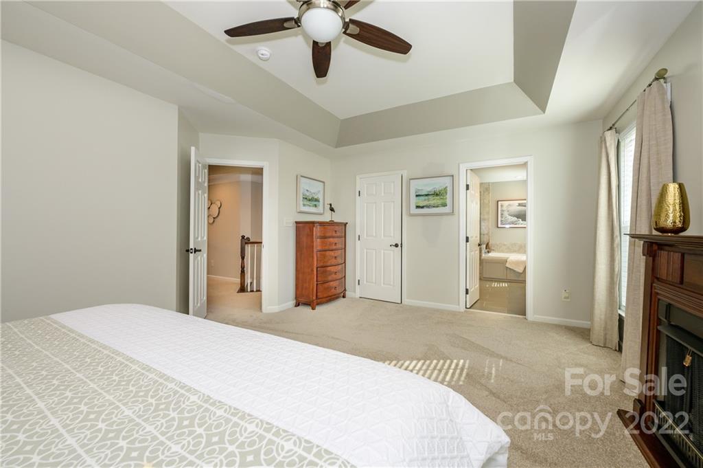 615 Circle Trace Road Monroe, NC 28110 - Photo 25 of 35 a spacious bedroom with a bed and a flat screen tv