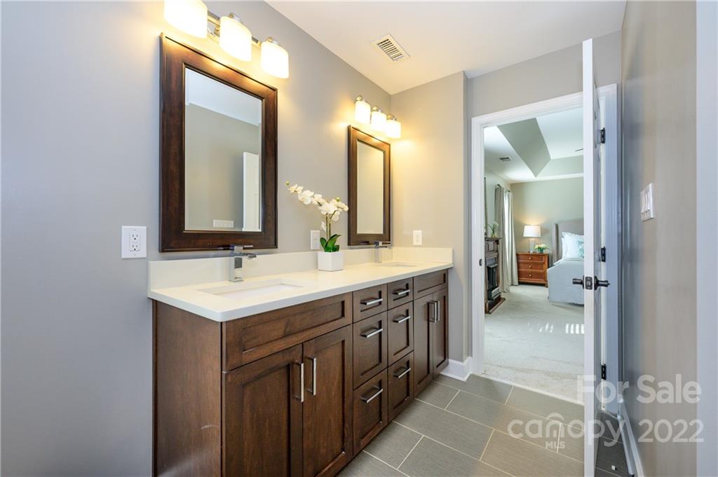 615 Circle Trace Road Monroe, NC 28110 - Photo 27 of 35 a bathroom with a double vanity sink and a mirror