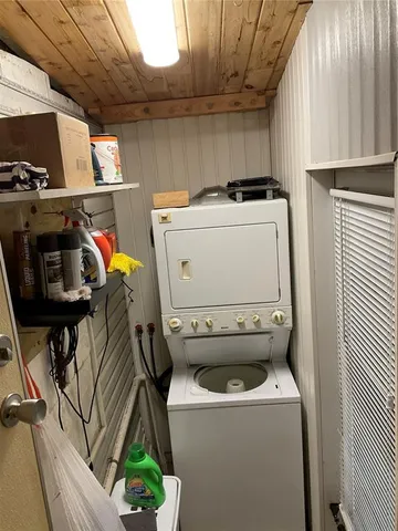 a building outdoor space with patio furniture and potted plants