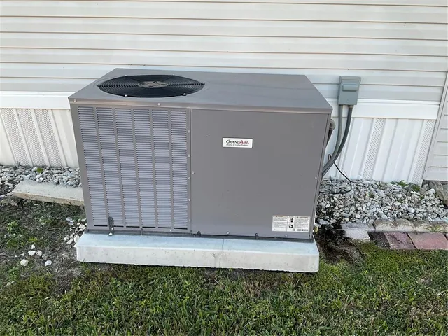 a view of houses with a yard