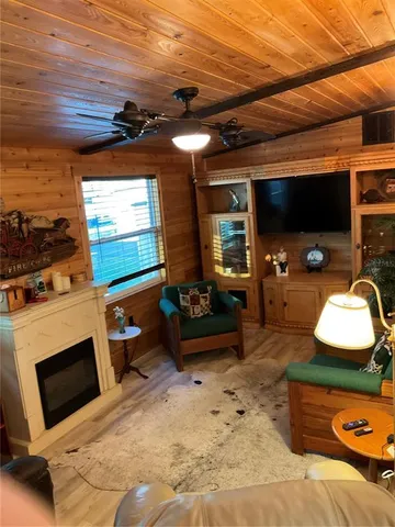 a living room with furniture and flat screen tv