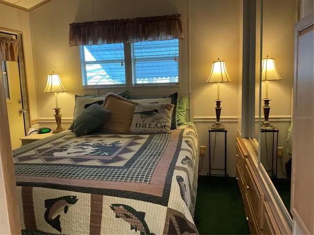 a bathroom with a sink a mirror and vanity