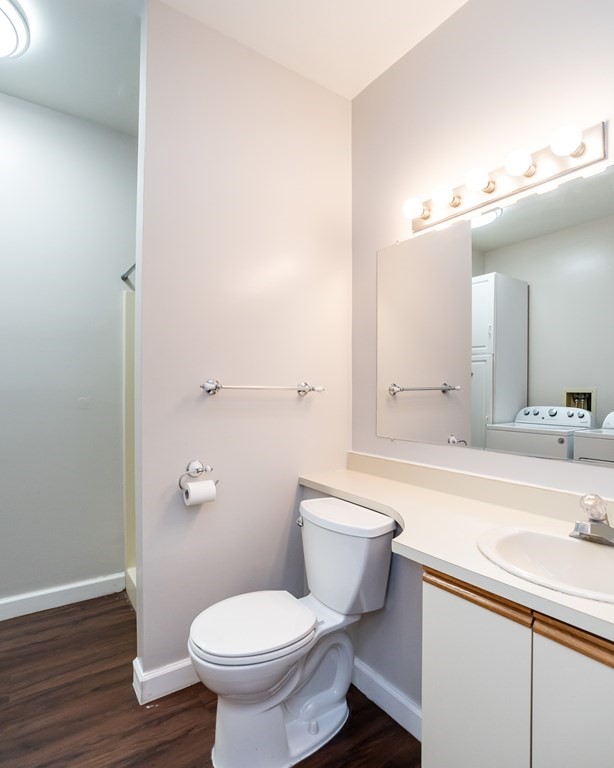 30 Mattoon Street, Unit 3 Springfield, MA 01105 - Photo 29 of 38 a bathroom with a sink toilet a mirror and vanity