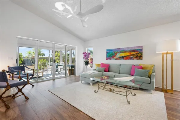 a living room with furniture and flowers floor