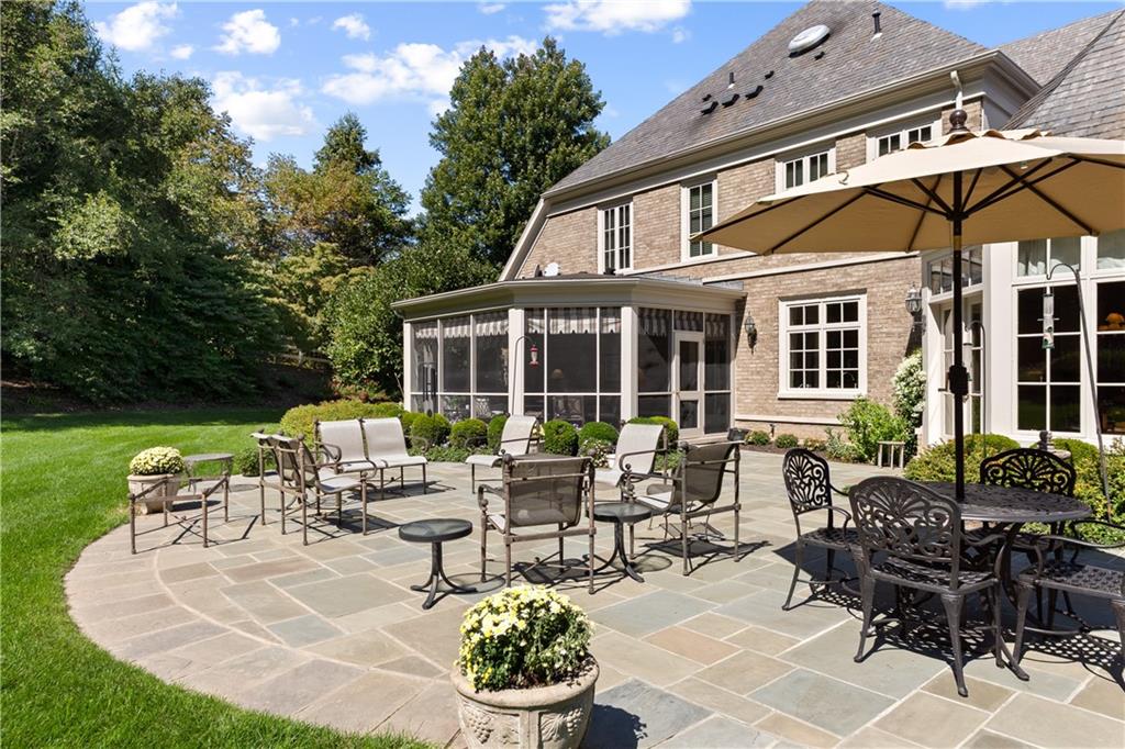 282 Justabout Road Venetia, PA 15367 - Photo 46 of 50 a view of a patio with couches table and chairs and potted plants