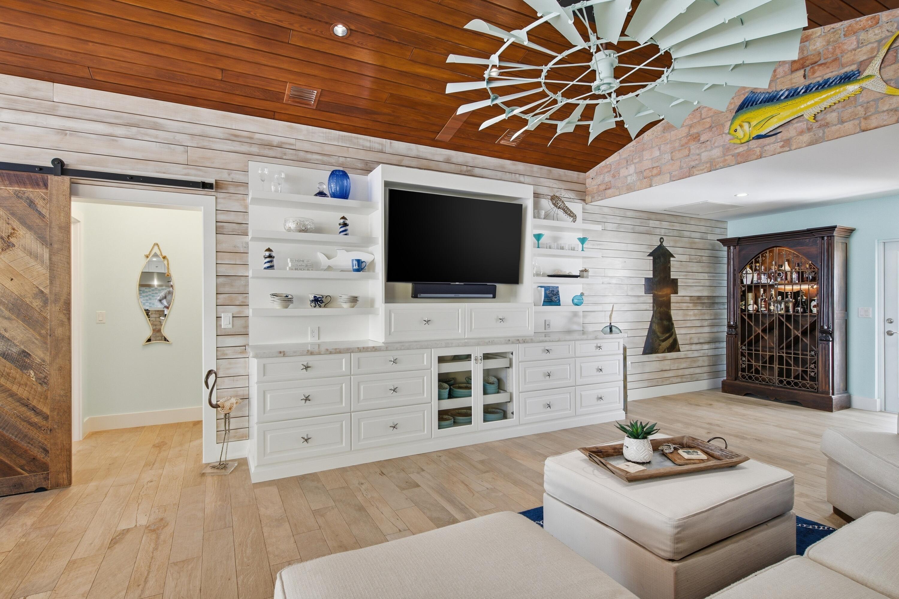101 Oleander Circle Key Largo, FL 33037 - Photo 13 of 126 a living room with furniture and a flat screen tv