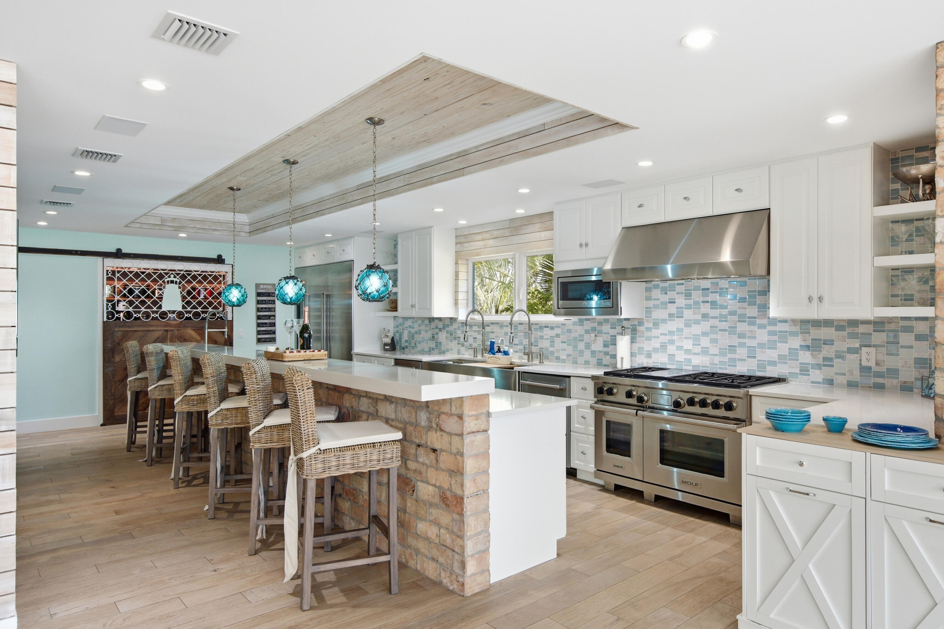 101 Oleander Circle Key Largo, FL 33037 - Photo 17 of 126 a kitchen with appliances a sink a counter top space and a center island