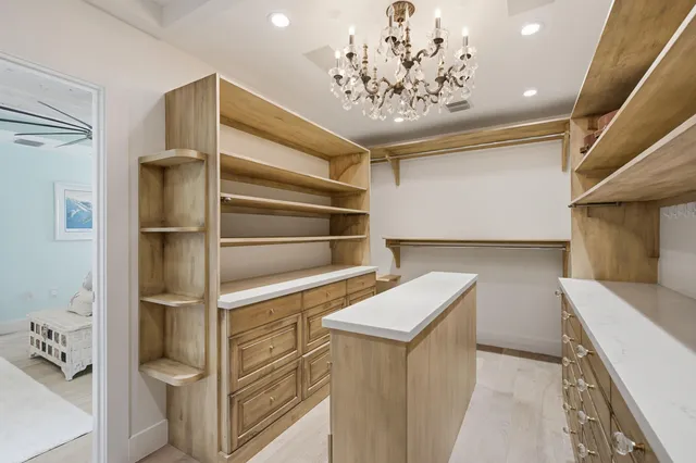 a living room with furniture a flat screen tv and a table