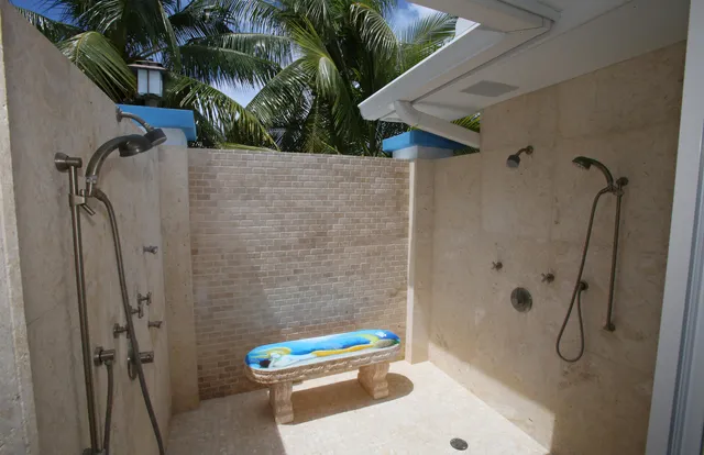 a view of a bedroom with baby crib and hanging chair