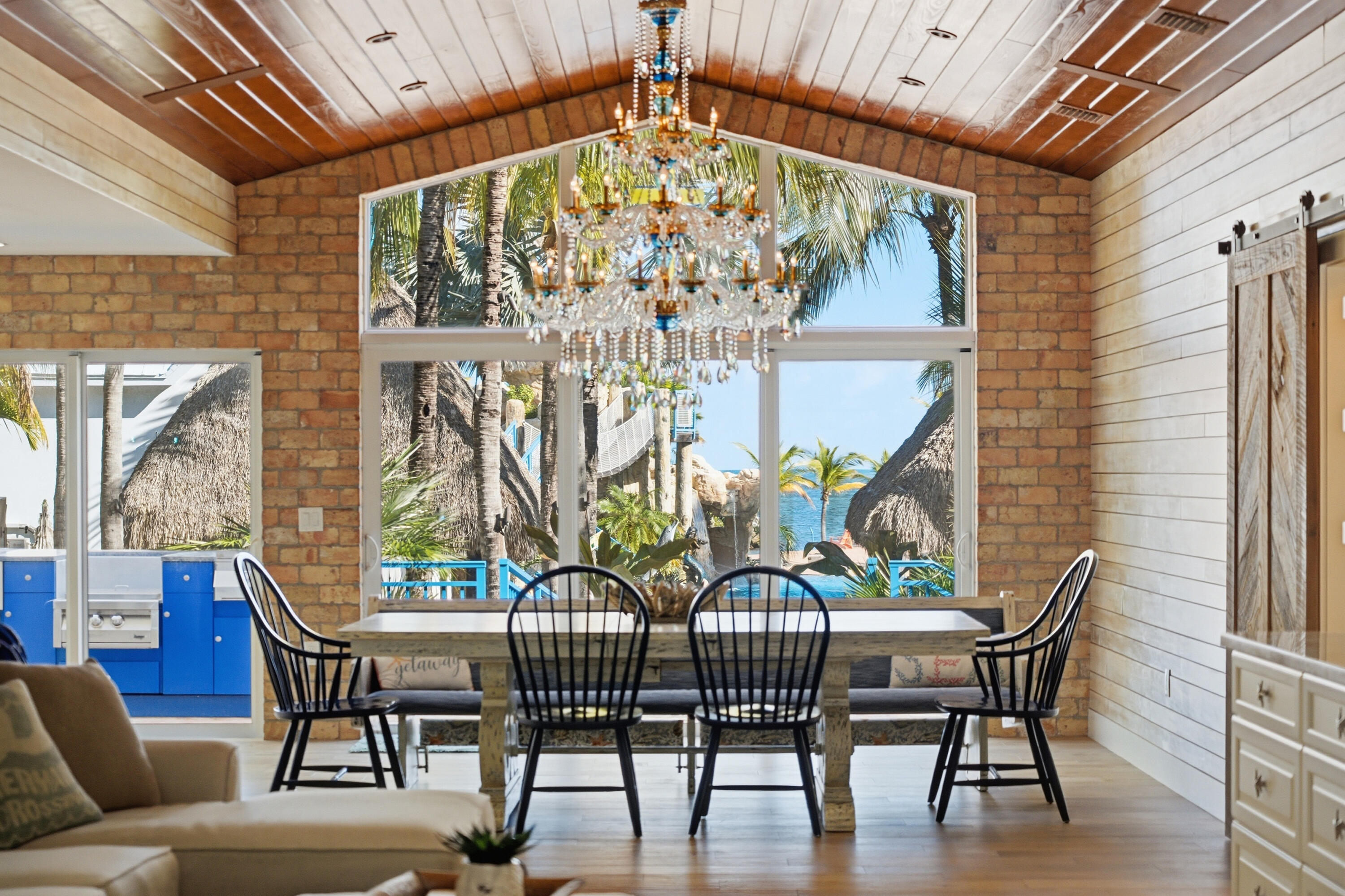 101 Oleander Circle Key Largo, FL 33037 - Photo 34 of 126 a view of a dining room with furniture wooden floor and a chandelier