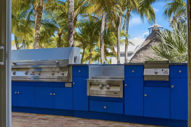 a kitchen with stainless steel appliances granite countertop a refrigerator and a stove