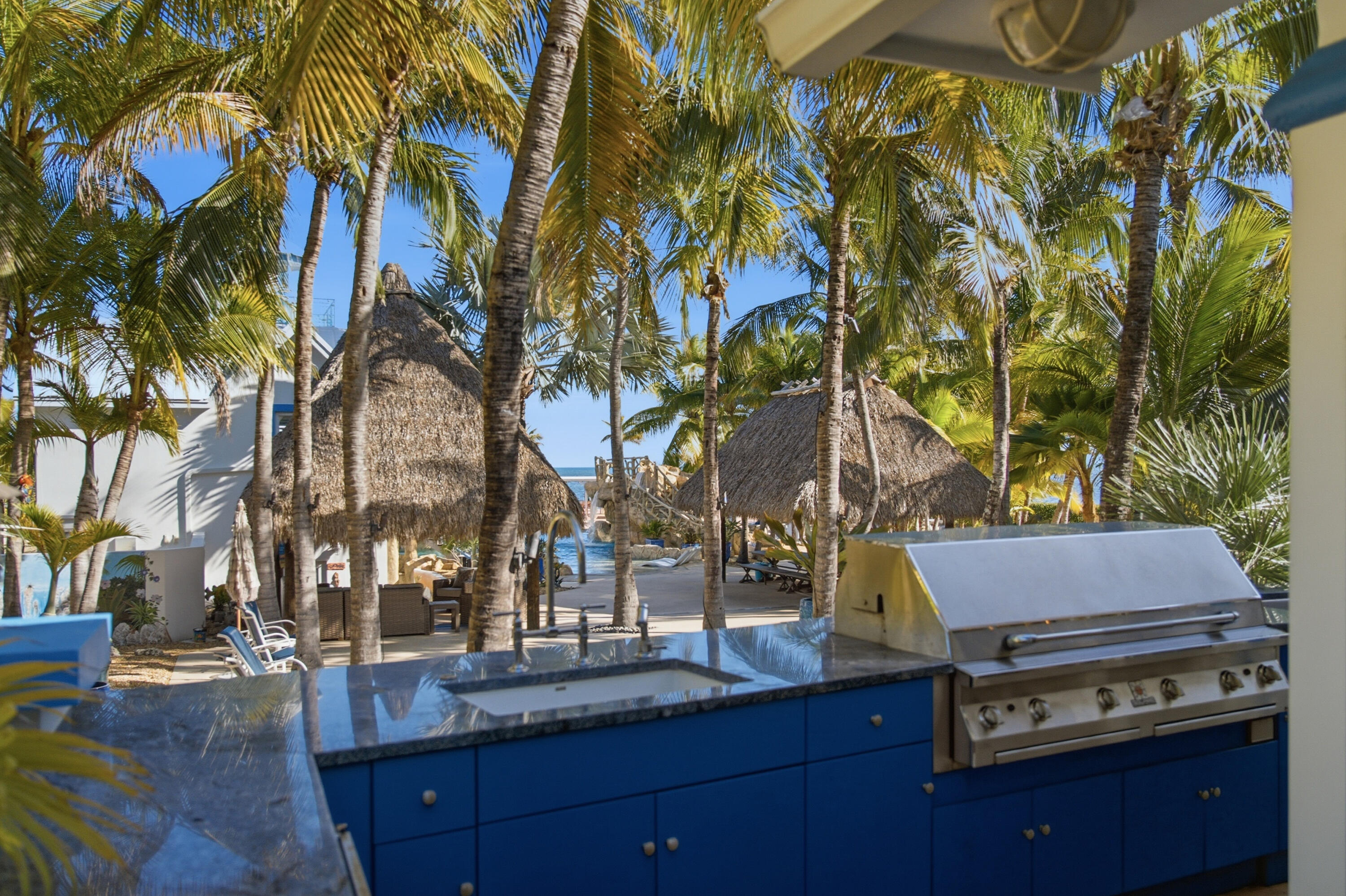 101 Oleander Circle Key Largo, FL 33037 - Photo 37 of 126 a backyard of a house with barbeque oven and outdoor seating