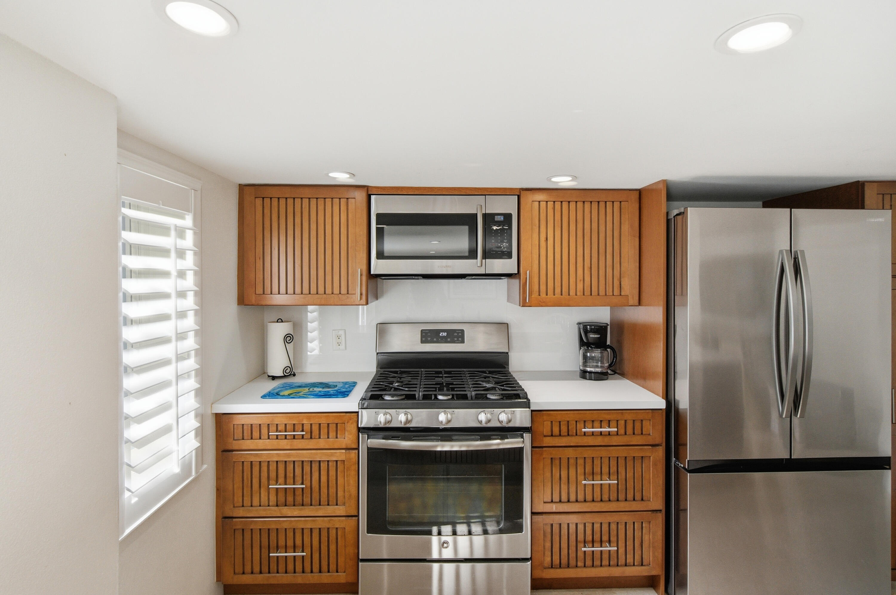 101 Oleander Circle Key Largo, FL 33037 - Photo 52 of 126 a kitchen with stainless steel appliances granite countertop a stove a refrigerator and a cabinets