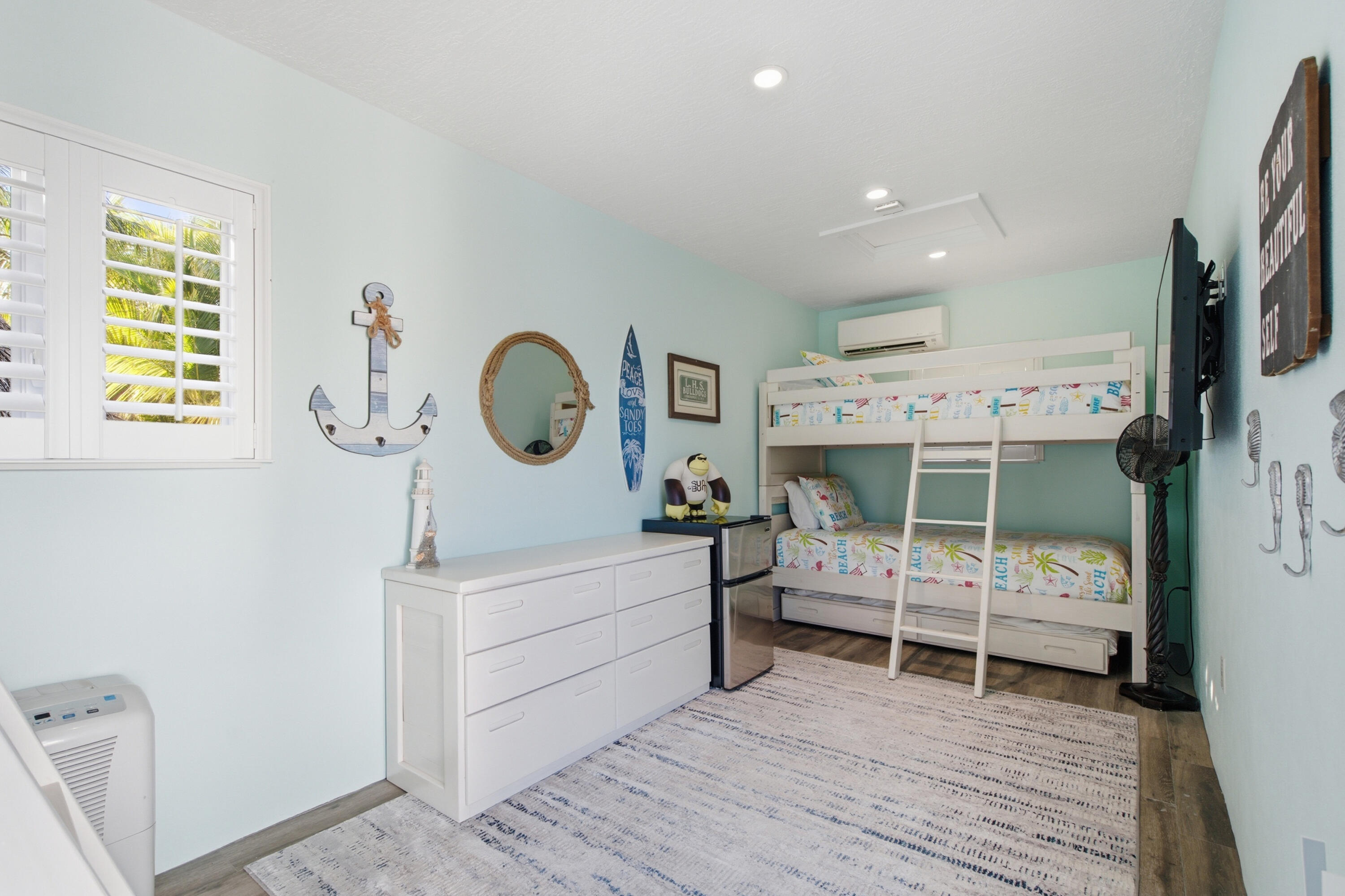 101 Oleander Circle Key Largo, FL 33037 - Photo 64 of 126 a view of a bedroom with baby crib and hanging chair