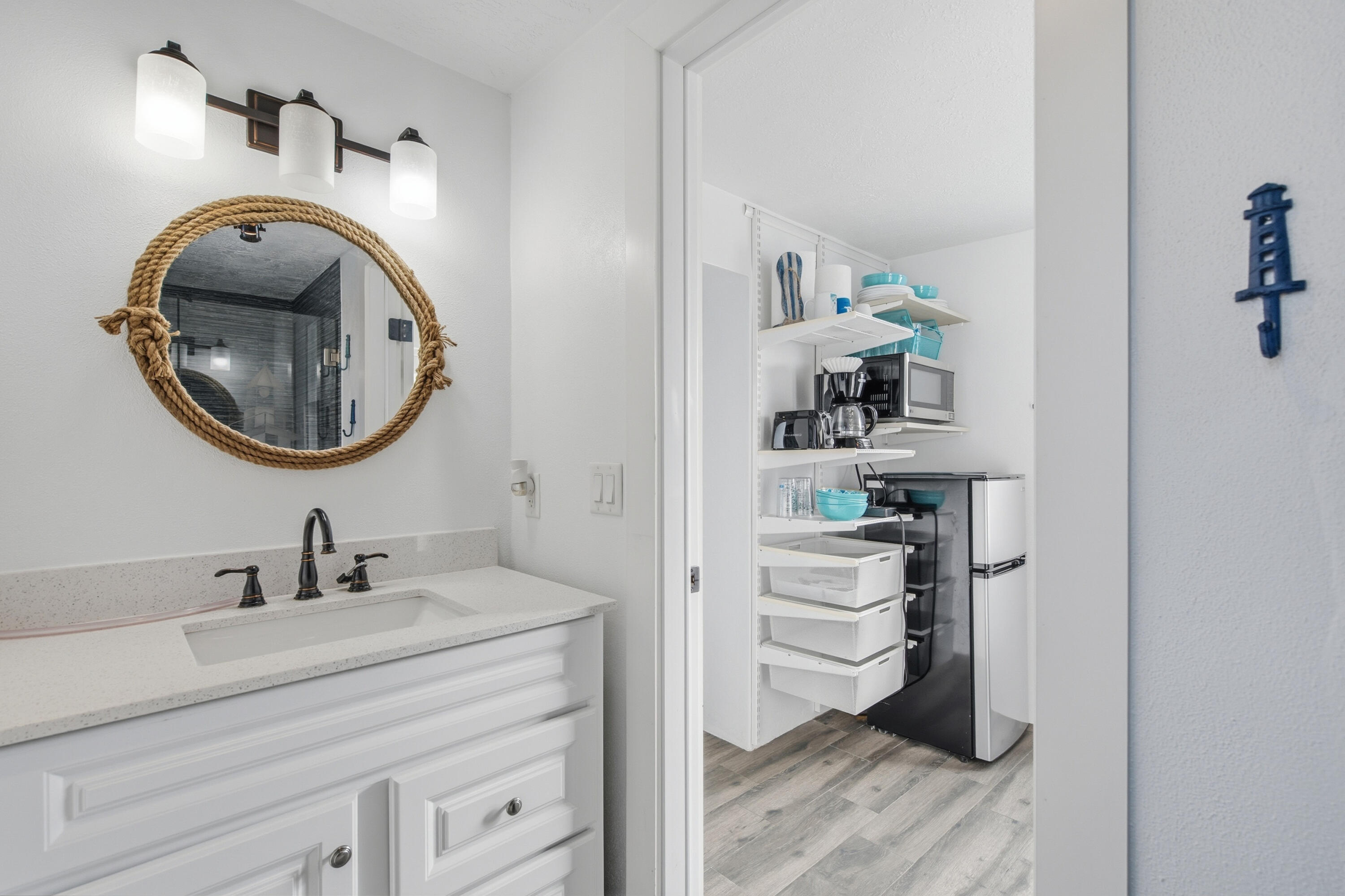 101 Oleander Circle Key Largo, FL 33037 - Photo 76 of 126 a en suite bathroom with a sink and a mirror