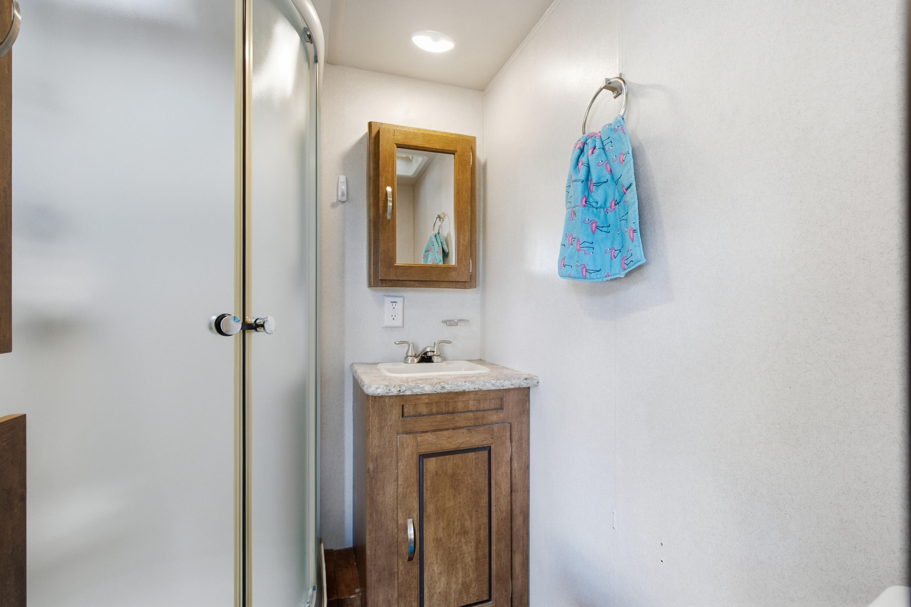 101 Oleander Circle Key Largo, FL 33037 - Photo 83 of 126 a bathroom with a sink and mirror with toilet