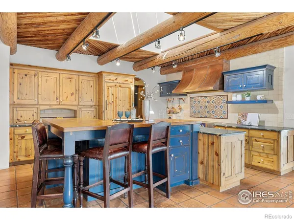 a dinning table and chairs in a kitchen